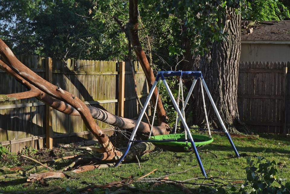 Hallsville residents like Kay Dollinger on Friday were dealing with the aftermath of a severe thunderstorm Thursday night that brought with it high winds, bringing down many tree limbs throughout the community.