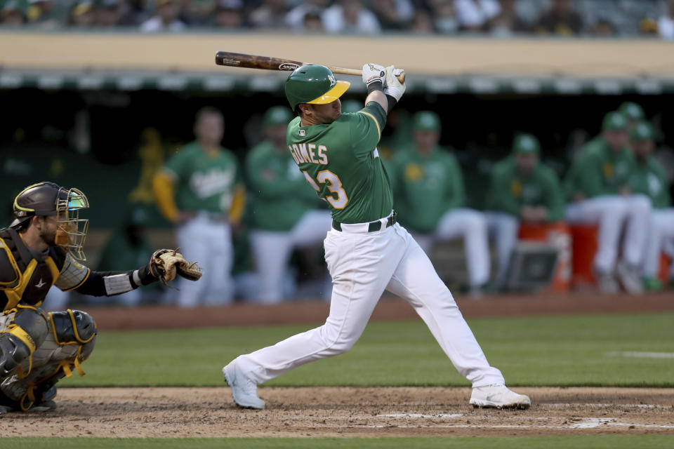 FILE - Oakland Athletics' Yan Gomes bats against the San Diego Padres during a baseball game in Oakland, Calif., Tuesday, Aug. 3, 2021. The Chicago Cubs added another catcher on Tuesday, Nov. 30, agreeing to a $13 million, two-year contract with Yan Gomes. A person with direct knowledge of the contract confirmed the deal to The Associated Press on Tuesday on condition of anonymity because it had not been finalized. (AP Photo/Jed Jacobsohn, File)