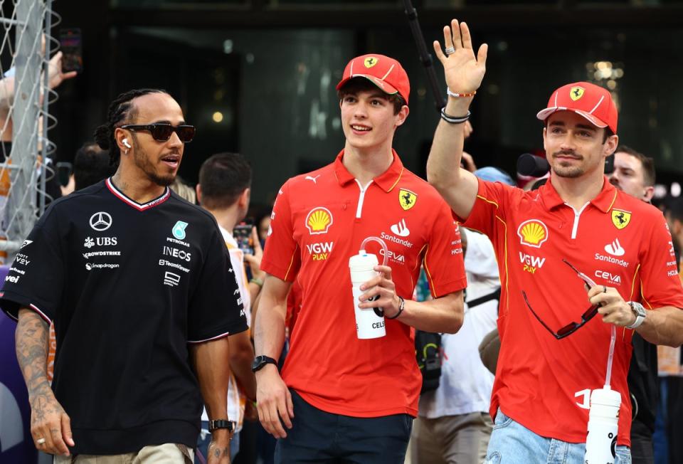 Bearman on his way to his first drivers’ parade with Lewis Hamilton and Charles Leclerc (Getty Images)