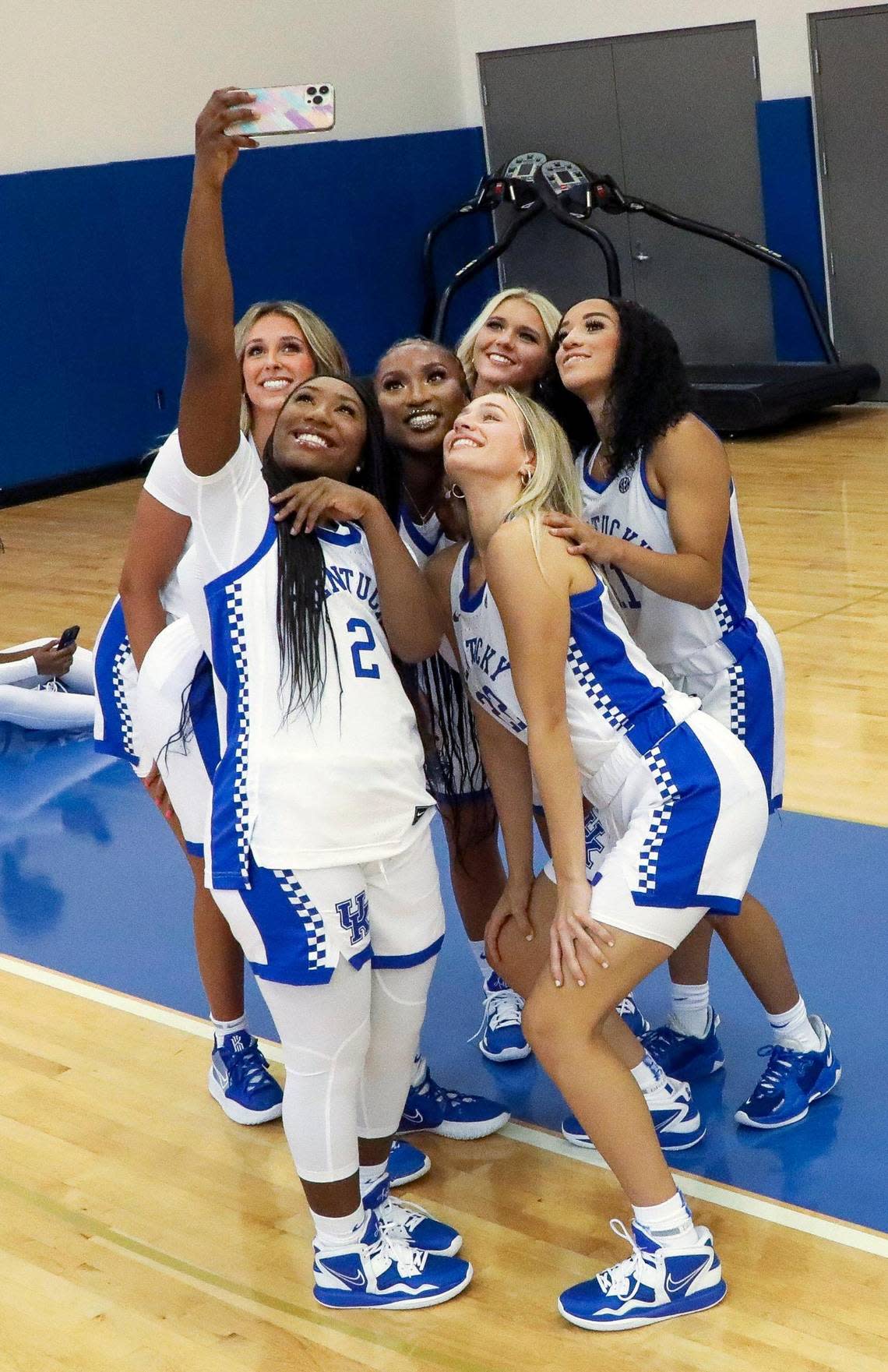 University of Kentucky basketball players clockwise from top, Blair Green, Adebola Adeyeye, Cassidy Rowe, Jada Walker, Maddie Scherr and Saniah Tyler take a selfie during the team’s photo day at the Joe Craft Center on Wednesday.