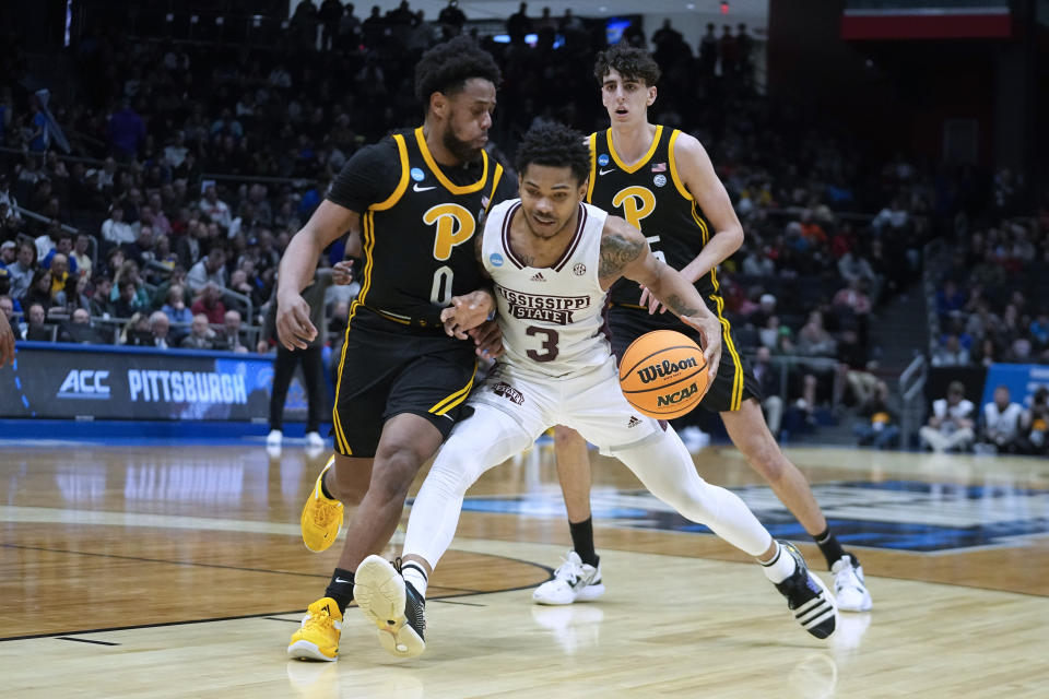 Mississippi State's Shakeel Moore (3) is defended by Pittsburgh's Nelly Cummings (0) during the second half of a First Four game in the NCAA men's college basketball tournament Tuesday, March 14, 2023, in Dayton, Ohio. (AP Photo/Darron Cummings)