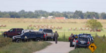 <p>Authorities investigate the site of a hot air balloon accident in Maxwell, Texas on July 30, 2016. (AARON M. SPRECHER/AFP/Getty Images)</p>