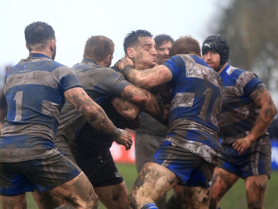 Toronto Wolfpak's Craig Hall is held up by the Siddal defence (PA)