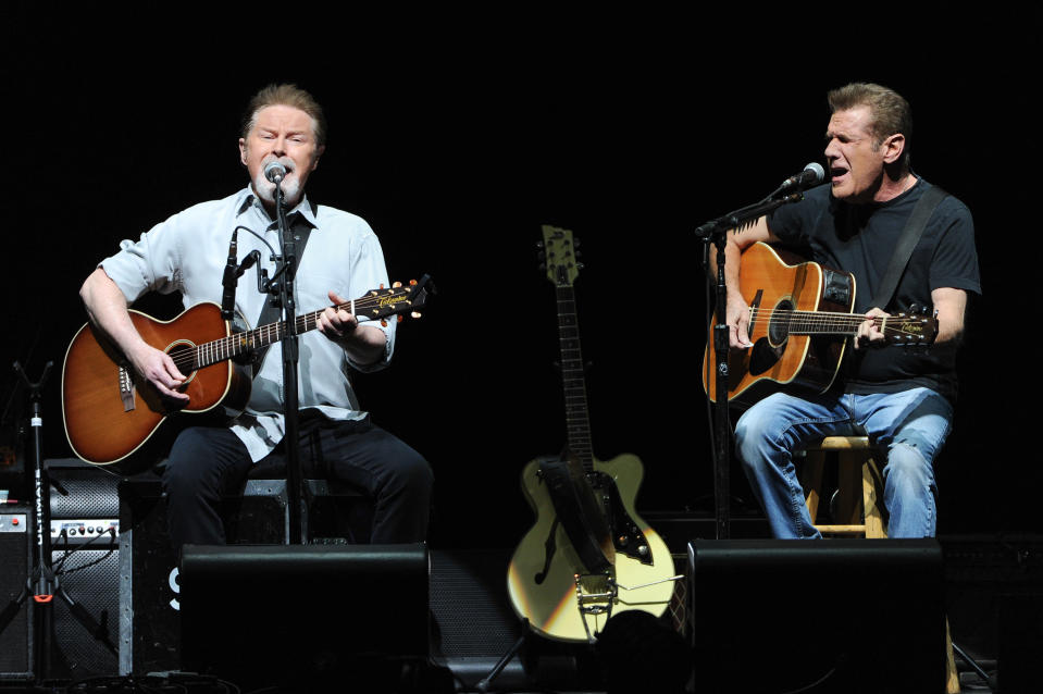 Musicians Don Henley, left, and Glenn Frey of the Eagles perform at Madison Square Garden on Friday, Nov. 8, 2013 in New York. (Photo by Evan Agostini/Invision/AP)