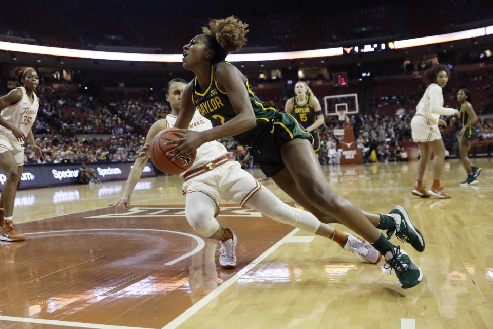 Baylor guard DiDi Richards (2) and Texas guard Celeste Taylor collide during the first half of an NCAA college basketball game Friday, Jan. 31, 2020, in Austin, Texas. (AP Photo/Eric Gay)