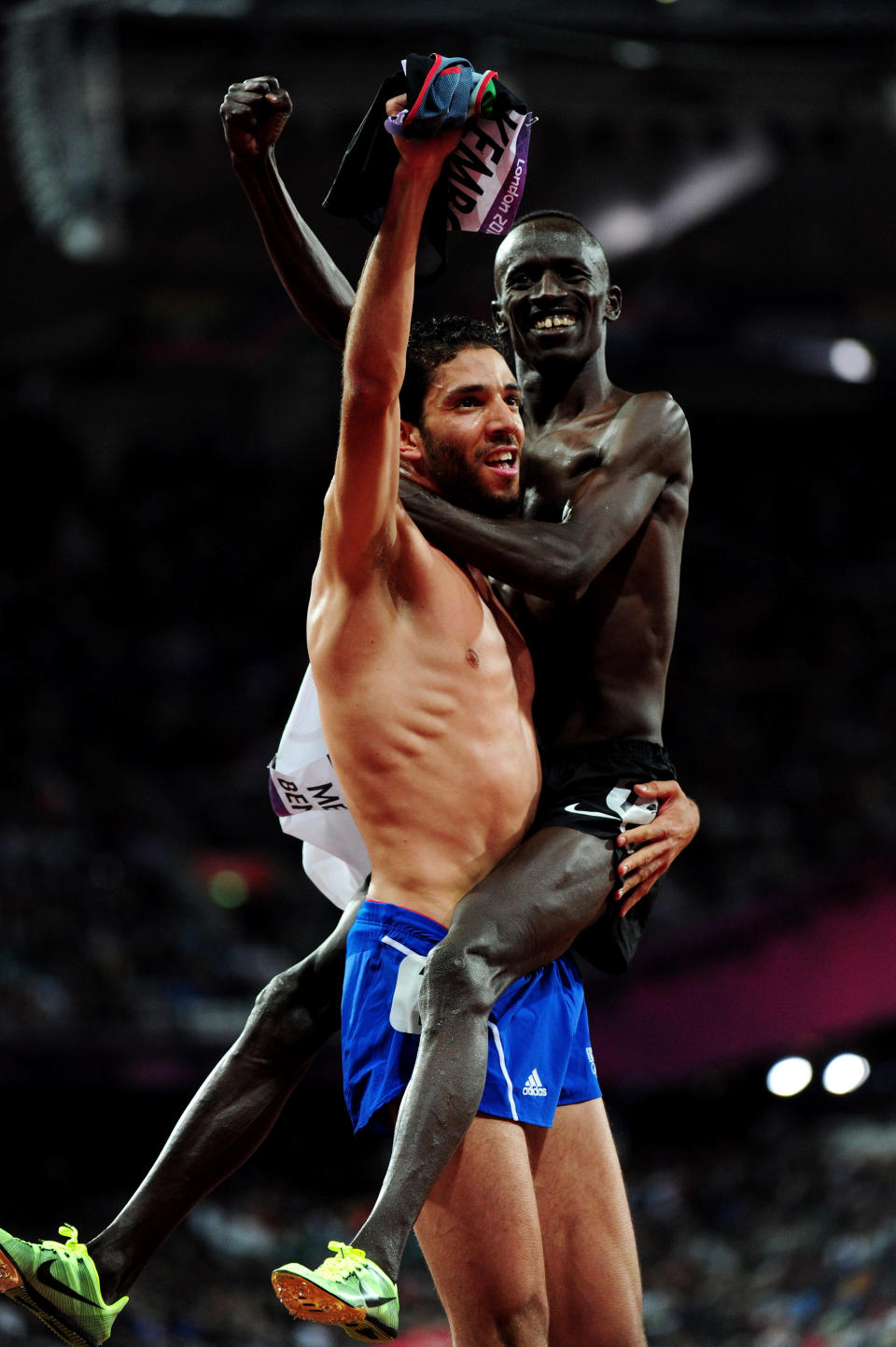 LONDON, ENGLAND - AUGUST 05: Silver medalist Mahiedine Mekhissi-Benabbad of France celebrates with gold medalist Ezekiel Kemboi of Kenya celebrate after the Men's 3000m Steeplechase on Day 9 of the London 2012 Olympic Games at the Olympic Stadium on August 5, 2012 in London, England. (Photo by Stu Forster/Getty Images)