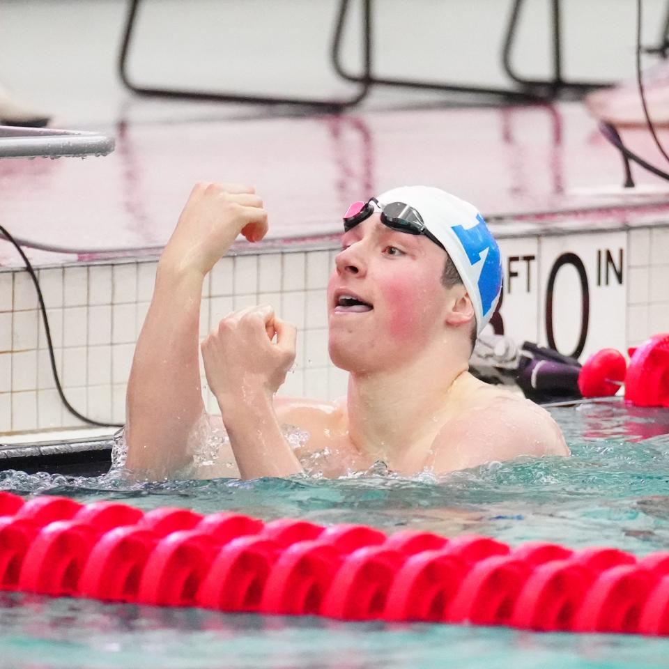 Nicolet's Jack Sullivan celebrates after winning the 100-yard freestyle Friday, one of two two events in which he broke state records during the WIAA Division 2 boys state swimming and diving championships at Waukesha South.