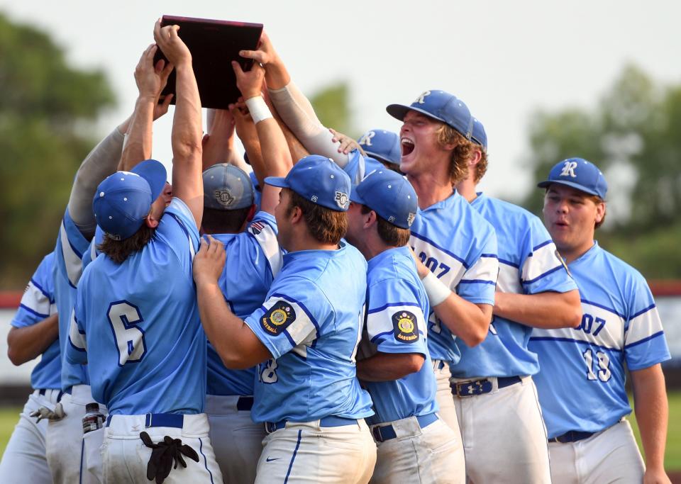 Renner holds their winning trophy aloft after winning the American Legion state baseball championship on Tuesday, July 27, 2021 at Aspen Park in Brandon.