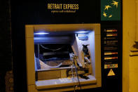 A damaged bank cash machine of BNP Paribas bank is seen on avenue Kleber after clashes with protesters wearing yellow vests, a symbol of a French drivers' protest against higher diesel taxes, in Paris, France, December 1, 2018. REUTERS/Charles Platiau