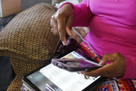 Mary Christian, 71, of McComb, Miss., recalls Friday, Jan. 15, 2021, the hours she spent on both her cell phone and iPad trying to arrange an appointment online for a COVID-19 vaccination through the Mississippi State Department of Health web site and on their listed registration phone line. Eventually, with help from one of her sons, she was able to enter the registration site only to find vaccination locations with openings were at least an hour's drive from the county she lives in and upon trying to sign up was informed they had no more openings. (AP Photo/Rogelio V. Solis)