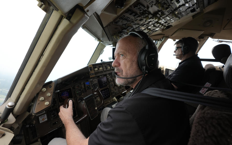 Honeywell test pilots Joe Duval, left, and Clint Coatney fly a Boeing 757 test aircraft demonstrating runway hazard warning systems over the airport in Tyler, Texas, Tuesday, June 4, 2024. (AP Photo/LM Otero)