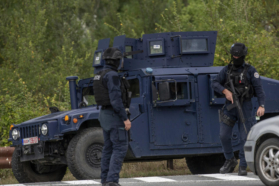 Kosovo police officers man a checkpoint near Banjska Monastery during a ongoing police operation in the village of Banjska on Monday, Sept. 25, 2023. Kosovo on Monday observed a day of mourning for the Kosovar Albanian police officer killed by Serb gunmen who then barricaded themselves in an Orthodox monastery in a siege that further raised tensions as the two wartime foes seek to normalize ties. In the north, where most of Kosovo’s ethnic Serb minority lives in four municipalities around Mitrovica, police were patrolling in search of the armed assailants after they left the monastery. (AP Photo/Visar Kryeziu)