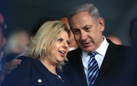 Israeli Prime Minister Benjamin (R) Netanyahu, his wife Sara Netanyahu (L) during the opening ceremony of the Maccabiah games in Ramat Gan, Israel. - Credit: EPA