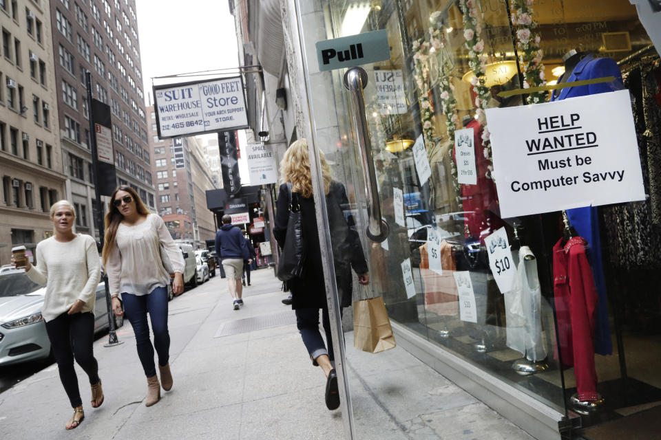 FILE - A "Help Wanted" sign hangs in a store window, Thursday, Oct. 1, 2015, in New York. About 1 in 5 American workers, including retail and construction workers, are bound by noncompete agreements, according to the Federal Trade Commission. New York Gov. Kathy Hochul hasn't said whether she intends to sign state legislation passed last June that would ban noncompete agreements. The legislation has come under a fierce attack by business groups. (AP Photo/Mark Lennihan, File)