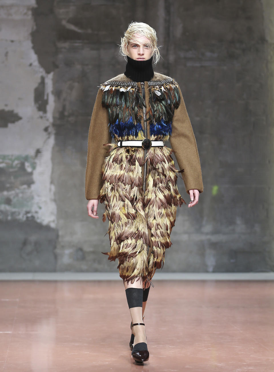 A model wears a creation for Marni women's Fall-Winter 2014-15 collection, part of the Milan Fashion Week, unveiled in Milan, Italy, Sunday, Feb. 23, 2014. (AP Photo/Antonio Calanni)