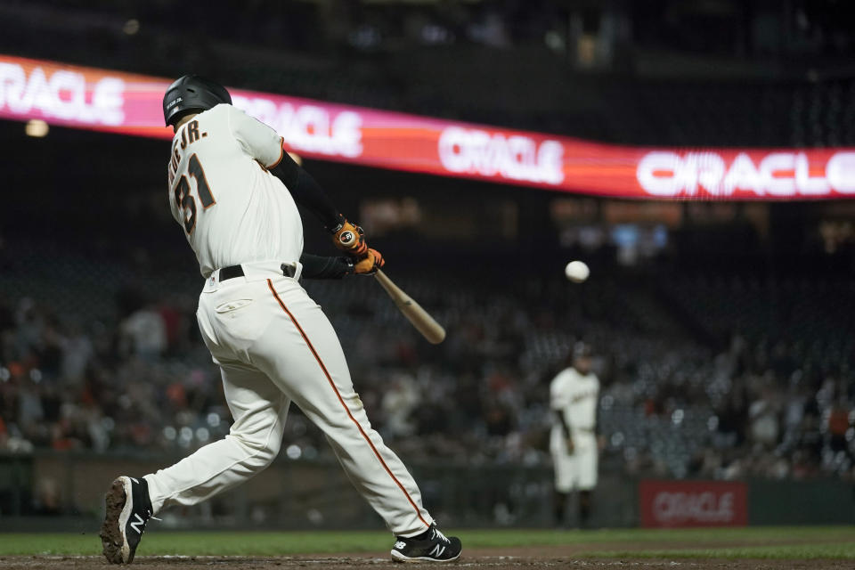 San Francisco Giants' LaMonte Wade Jr. hits the game-winning RBI single against the Cleveland Guardians during the 10th inning of a baseball game Monday, Sept. 11, 2023, in San Francisco. (AP Photo/Godofredo A. Vásquez)