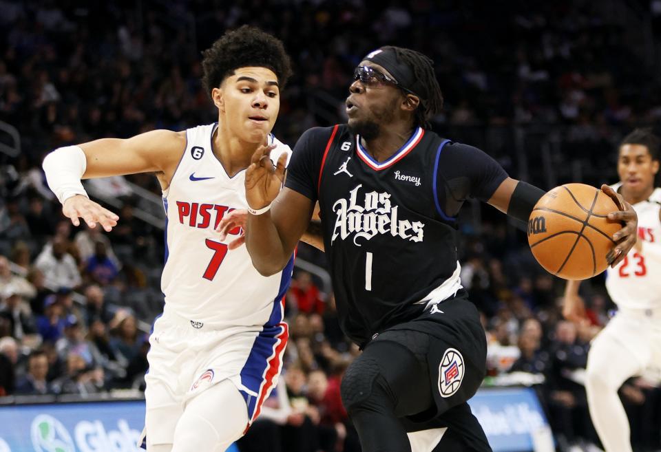 Los Angeles Clippers guard Reggie Jackson (1) drives to the basket against Detroit Pistons guard Killian Hayes (7) during the first half of an NBA basketball game, Monday, Dec. 26, 2022, in Detroit. (AP Photo/Duane Burleson)