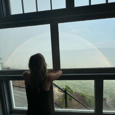 <p>Kristin Cavallari/Instagram</p> Cavallari admiring a rainbow