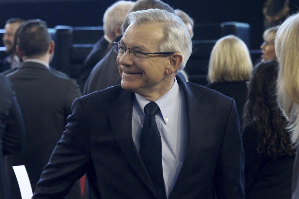 FILE - U.S. Rep. David Schweikert, R-Ariz., shown at Chase Field in Phoenix in this Jan. 7, 2022 file photo, greets people at an Arizona Chamber of Commerce and Industry event. Schweikert is seeking his seventh term in Congress and faces Democrat Jevin Hodge in November's election. (AP Photo/Bob Christie)