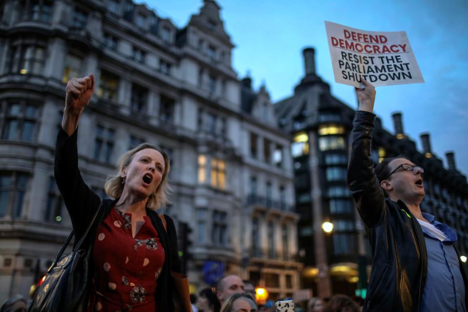 Anti-Brexit supporters take part in a protest in front of the Houses of Parliament in central London, Wednesday, Aug. 28, 2019.