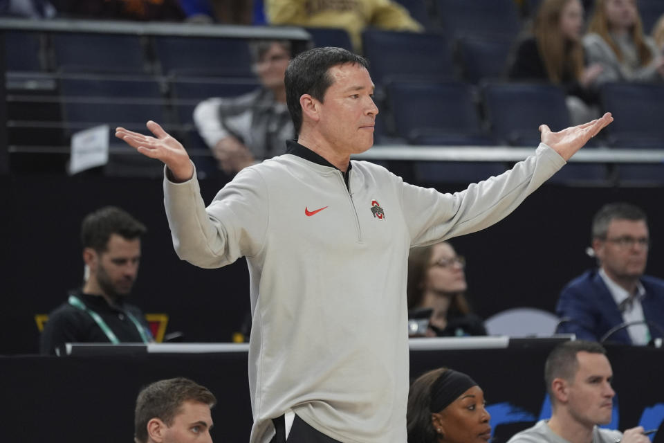 Ohio State head coach Kevin McGuff gestures during the second half of an NCAA college basketball quarterfinal game against Maryland at the Big Ten women's tournament Friday, March 8, 2024, in Minneapolis. Maryland upsets No. 3 Ohio State 82-61. (AP Photo/Abbie Parr)