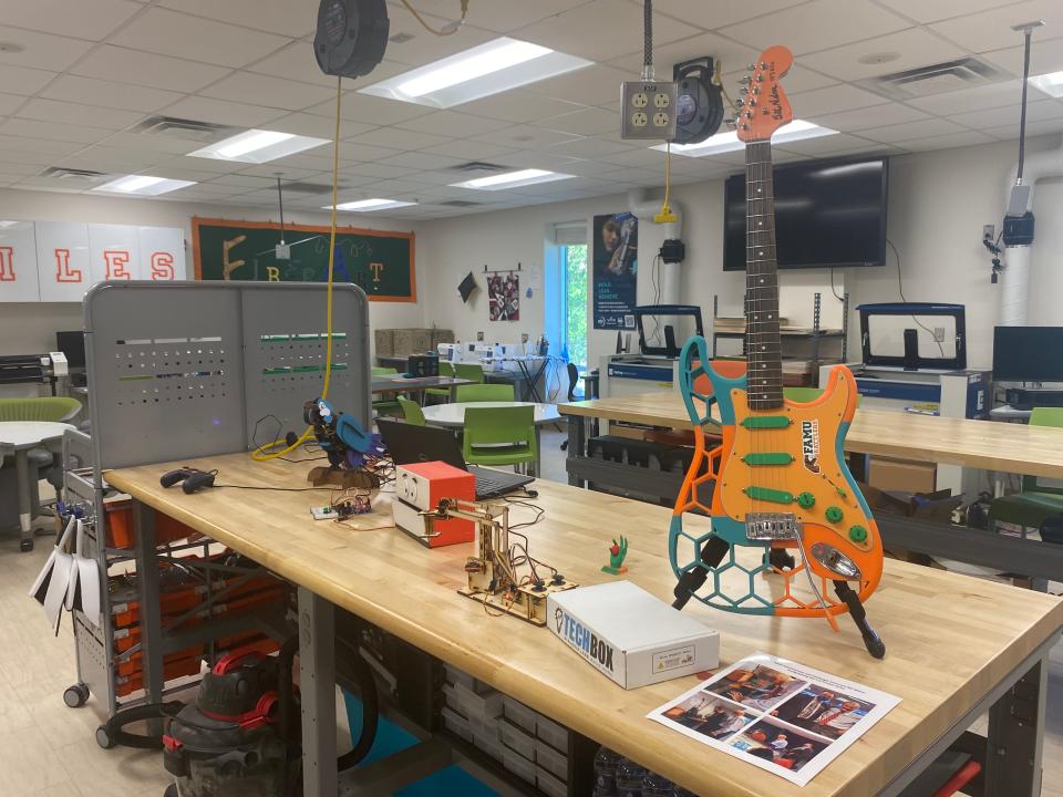 A 3-D printed guitar and a digitally fabricated singing parrot are put on display in the FAMU Chevron STR2EAM Innovation Fab Lab.