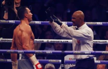 Britain Boxing - Anthony Joshua v Wladimir Klitschko IBF, IBO & WBA Super World Heavyweight Title's - Wembley Stadium, London, England - 29/4/17 Wladimir Klitschko receives a count by the referee after being knocked down by Anthony Joshua Action Images via Reuters / Peter Cziborra Livepic