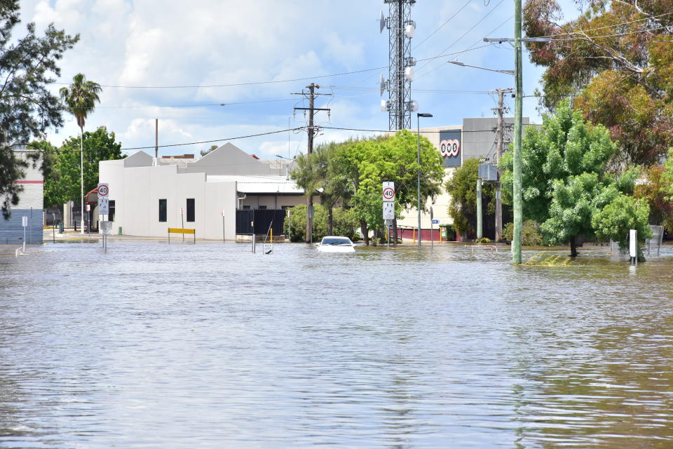 A car sits submerged in floodwater in Forbes, NSW, Sunday, November 6, 2022. Source: AAP