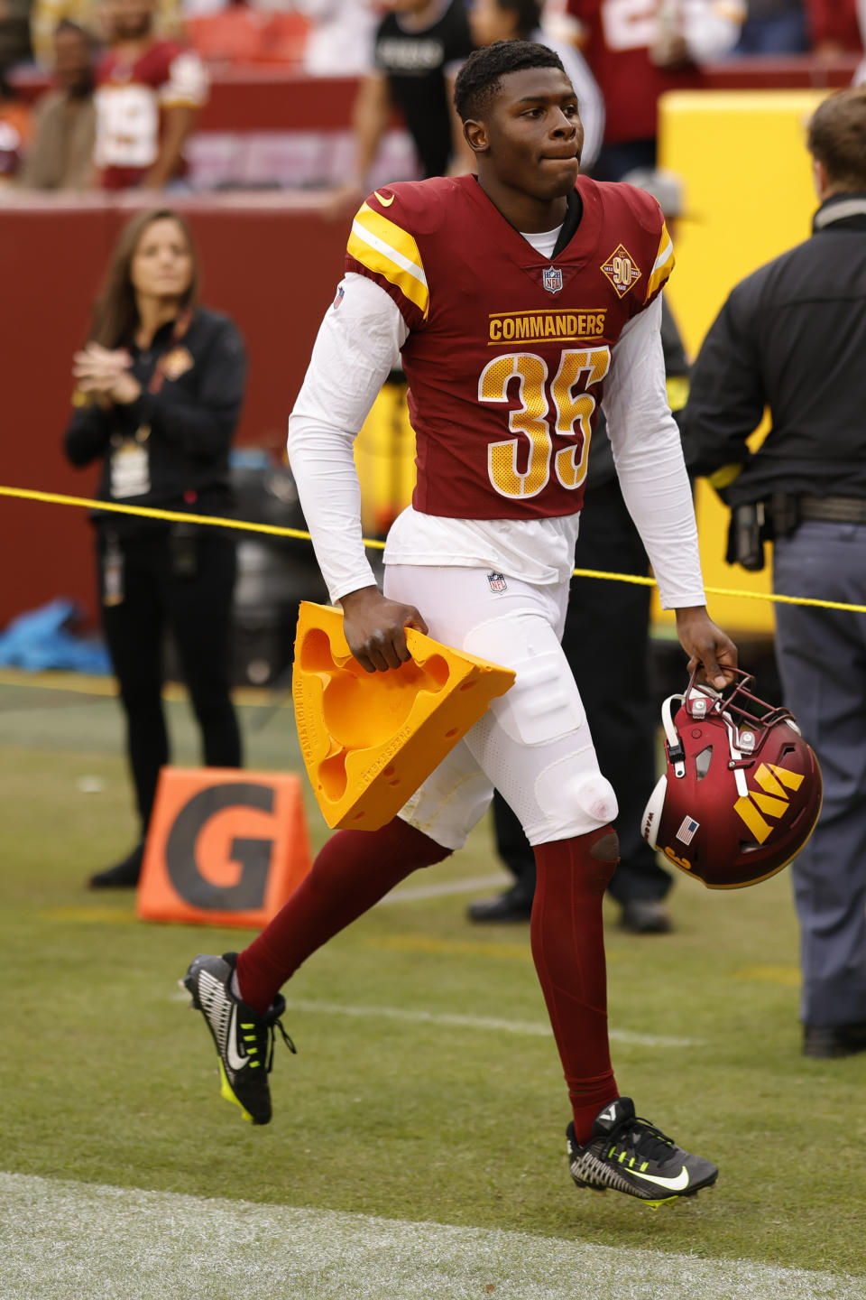 Washington Commanders safety Percy Butler (35) holds a cheesehead after the Commanders’ game against the <a class="link " href="https://sports.yahoo.com/nfl/teams/green-bay/" data-i13n="sec:content-canvas;subsec:anchor_text;elm:context_link" data-ylk="slk:Green Bay Packers;sec:content-canvas;subsec:anchor_text;elm:context_link;itc:0">Green Bay Packers</a>. Mandatory Credit: Geoff Burke-USA TODAY Sports