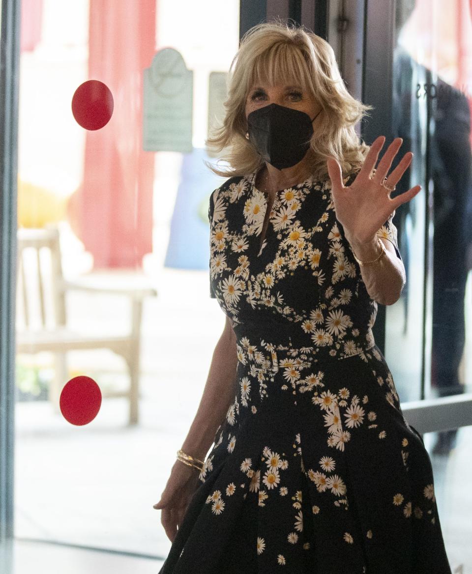 First Lady Jill Biden waves as she walks in Friday, March 25, 2022, at St. Jude Children's Research Hospital in Memphis.