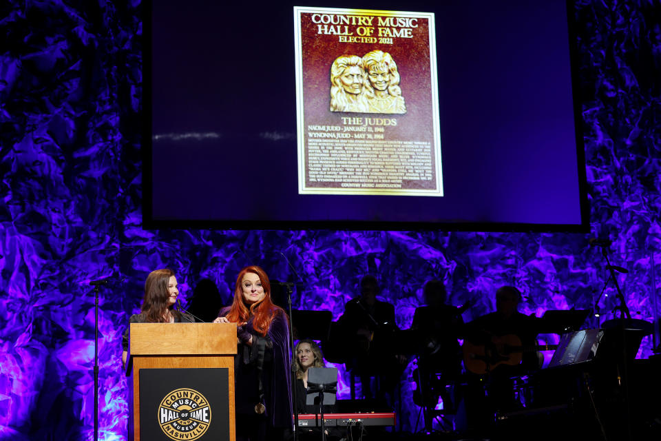 Ashley Judd and inductee Wynonna Judd speak onstage for the class of 2021 medallion ceremony at Country Music Hall of Fame and Museum on May 01, 2022 in Nashville, Tennessee. (Photo by Terry Wyatt/Getty Images for Country Music Hall of Fame and Museum) - Credit: Terry Wyatt for Country Music H