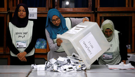 Maldives election commission officials prepare ballot papers for counting votes at a polling station at the end of the presidential election day in Male, Maldives September 23, 2018. REUTERS/Ashwa Faheem