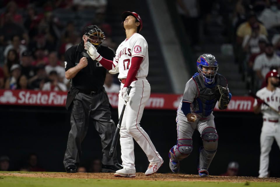 Los Angeles Angels' Shohei Ohtani reacts after being called out on strikes during the sixth inning of a baseball game against the Texas Rangers, Monday, Sept. 6, 2021, in Anaheim, Calif. (AP Photo/Marcio Jose Sanchez)