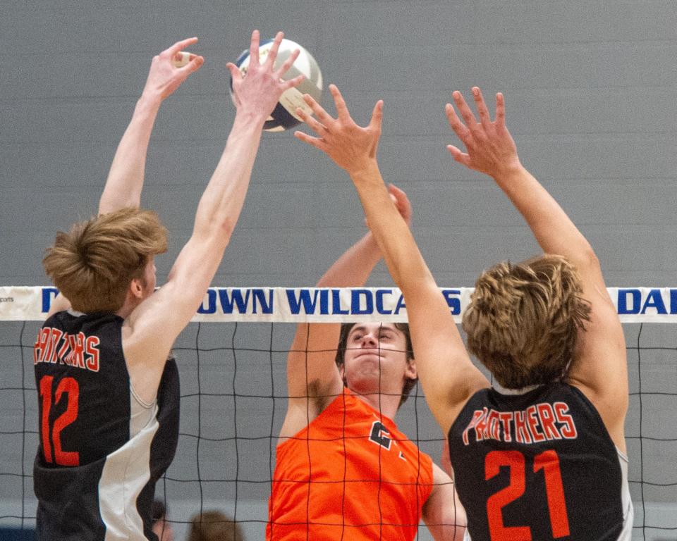 Central York’s Mason Boyer (12) and Trevor Ketrick block a hit by Northeastern’s Hugh Rogers in the YAIAA final at Dallastown HS on Tuesday, May 16, 2023.