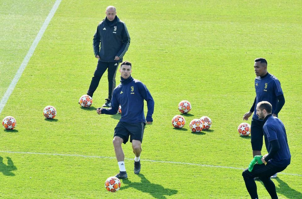 Juventus' Cristiano Ronaldo goes for the ball during Juventus' training session ahead of Wednesday's Champions League soccer match against Atletico Madrid, in Turin, Tuesday, Feb. 19, 2019. (Alessandro Di Marco/ANSA via AP)