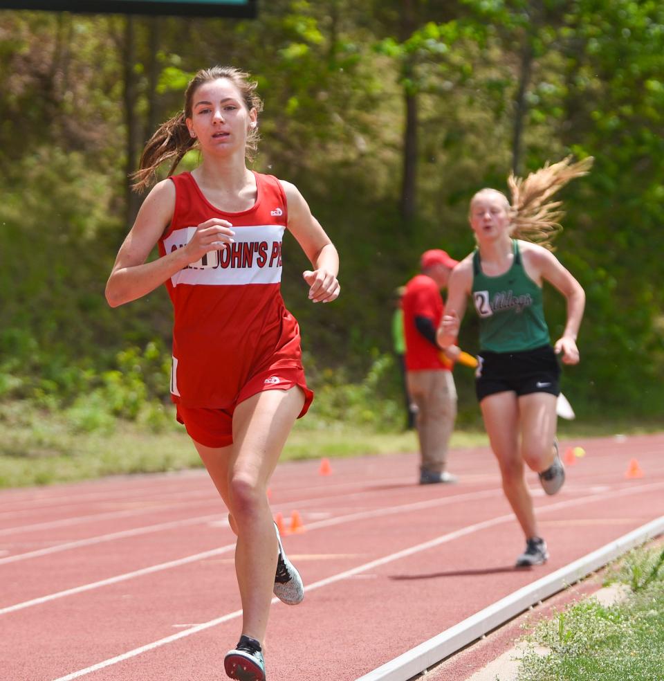 St. John's Prep sophomore Olivia Pauly leads the 1600m run Wednesday, June 1, 2022, at the Section 5A track and field meet at St. John's. 