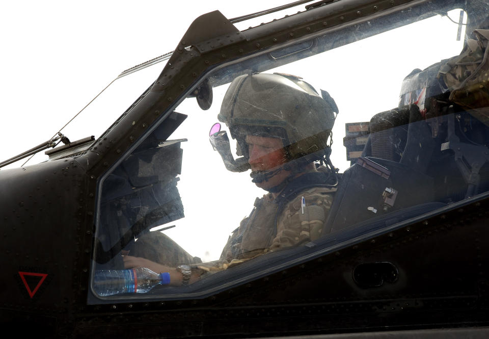 CAMP BASTION, AFGHANISTAN - OCTOBER 31:  In this image released on January 21, 2013, Prince Harry sits in the front cockpit of an Apache helicopter at the British controlled flight-line in Camp Bastion on October 31, 2012 in Afghanistan. Prince Harry has served as an Apache Helicopter Pilot/Gunner with 662 Sqd Army Air Corps, from September 2012 for four months until January 2013.  (Photo by John Stillwell - WPA Pool/Getty Images)