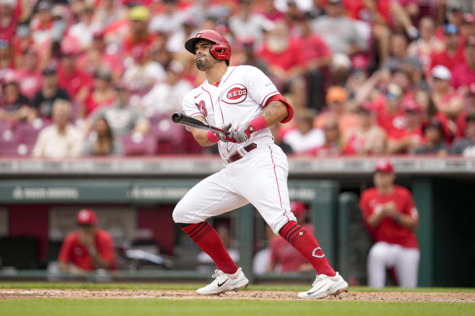 Cincinnati Reds' Christian Encarnacion-Strand (33) watches his two-run home run against the Miami Marlins during the fourth inning of a baseball game Wednesday, Aug. 9, 2023, in Cincinnati. (AP Photo/Jeff Dean)