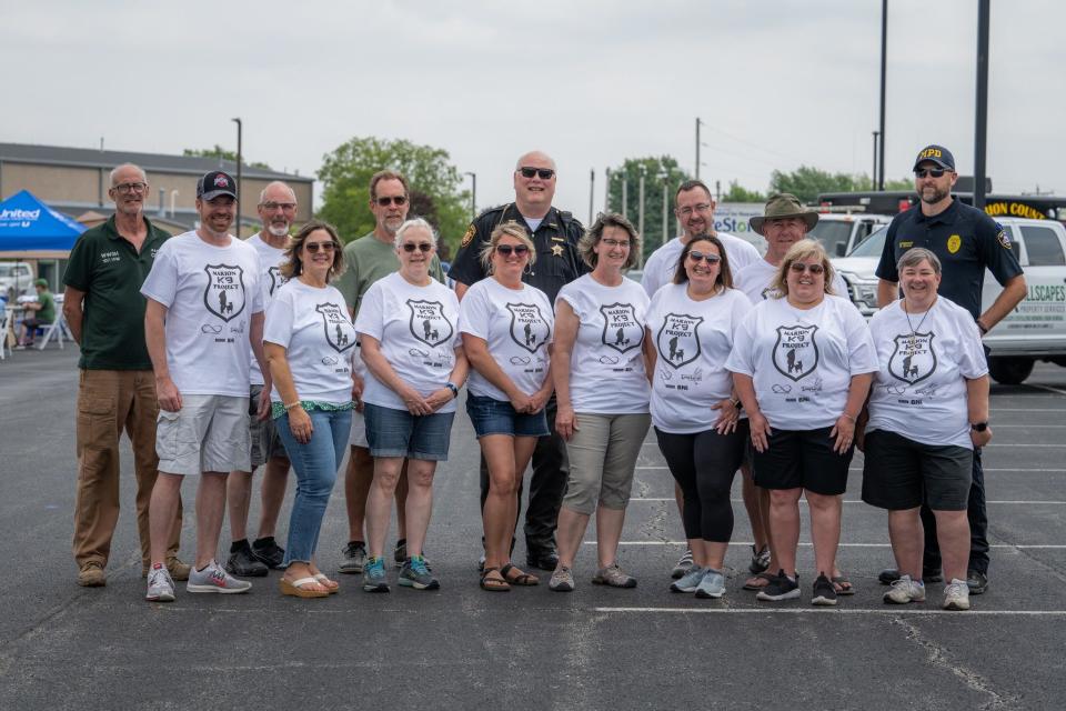 Members of the Marion Business Builders Chapter of BNI raised $33,000 in May for a new K-9 dog for Marion Police Dept. The remaining funds will be shared with the Marion Co. Sheriff’s Dept. for their K-9 unit. From left to right in the front row: Scott Ebert, Lisa Bush, Lynda Schrader, Leiha Lamb, Diane Watson, Michelle Albertini, Christy Neff and Jill Chitwood. Back row from left to right: Craig Heilman, Barry Hensley, Carl Wade, Sheriff Matt Bales, Adam Pfeiffer, and Lt. Mark Elliot with the Marion Police Dept.