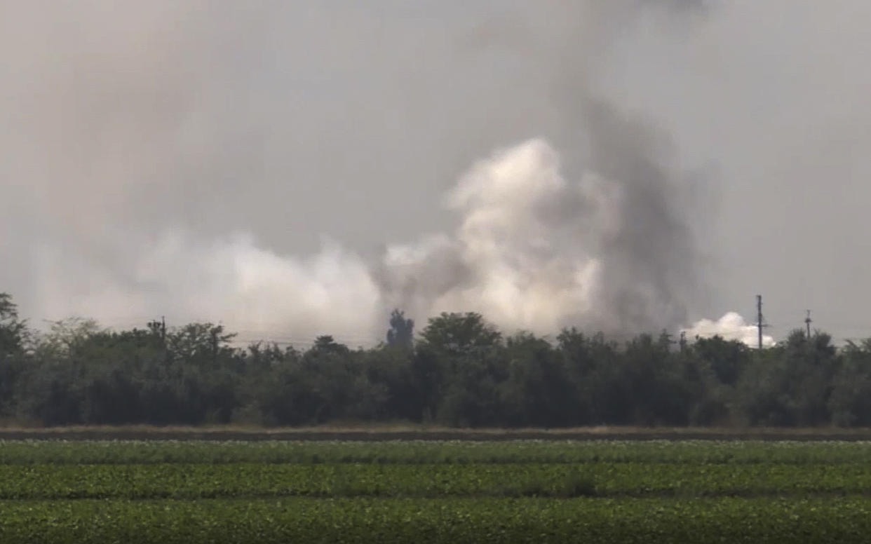 In this image taken from video provided by the RU-RTR Russian television on Tuesday, Aug. 16, 2022, smoke rises over the site of explosion at an ammunition storage of Russian army near the village of Mayskoye, Crimea. Explosions and fires ripped through an ammunition depot in Russian-occupied Crimea on Tuesday in the second suspected Ukrainian attack on the peninsula in just over a week, forcing the evacuation of more than 3,000 people. (RU-RTR Russian Television via AP) RUSSIA OUT