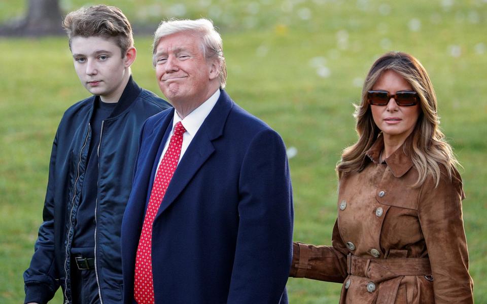Barron Trump with his parents Donald and Melania on the South Lawn at the White House - Tom Brenner/Reuters