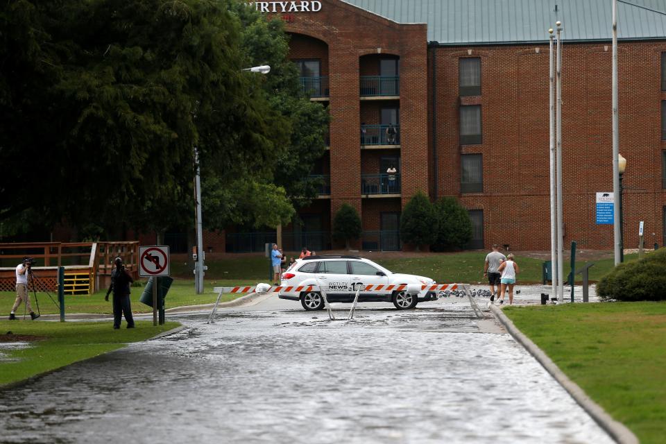 Heavy rain floods a street as the outer bands of Hurricane Florence hit New Bern on Thursday.