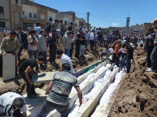 Shaam News Network photo claims to show show people watching the burial on May 26 of more than 100 massacre victims in the Syrian town of Houla. Kofi Annan told President Bashar al-Assad of the world's "grave concern" about violence in Syria, including the Houla massacre, in a meeting Tuesday, the envoy's office said. AFP is using pictures from alternative sources as it was not authorised to cover this event