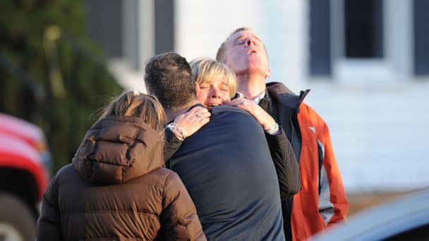 PHOTO: People embrace in the aftermath of the shooting at Sandy Hook Elementary School in Newtown, Conn., Dec. 14, 2012. (Don Emmert/AFP via Getty Images, FILE)