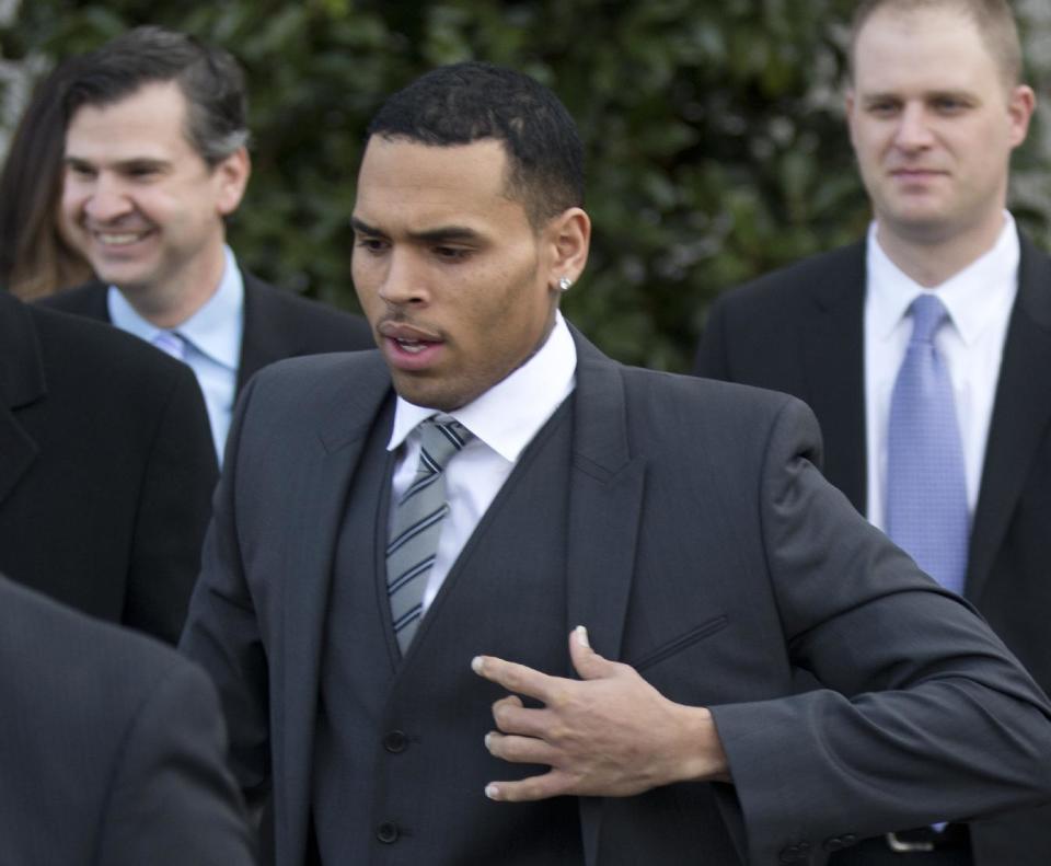 Singer Chris Brown, leaves the District of Columbia Superior Court in Washington, Wednesday, Jan. 8, 2014. Lawyers for Brown say the singer has rejected a plea deal in a case in which he’s accused of hitting a man outside a Washington hotel. Brown appeared Wednesday afternoon in a D.C. court. He and his bodyguard face a misdemeanor assault charge after an incident in October outside the W Hotel. (AP Photo/Manuel Balce Ceneta)