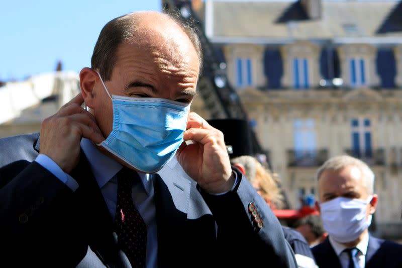 French Prime Minister Jean Castex adjusts his protective mask before taking to the media, after the blaze at the Cathedral of Saint Pierre and Saint Paul in Nantes