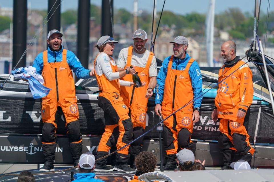 Members of the 11th Hour Racing Team celebrate their first place finish in the fourth leg of The Ocean Race.