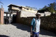 Simon Comie walks away from the Orphanage of the Church of Bible Understanding, after asking about the whereabouts of his 4-year-old daughter in Kenscoff, just outside of Port-au-Prince, Haiti, Saturday, Feb. 15, 2020. A fire swept through the children’s home run by a Pennsylvania-based religious nonprofit group, killing 15 children, officials said Friday. It is common in Haiti for impoverished parents to place children in residential care centers, where they receive lodging and widely varying education for several years but are not technically orphans. (AP Photo/Dieu Nalio Chery)