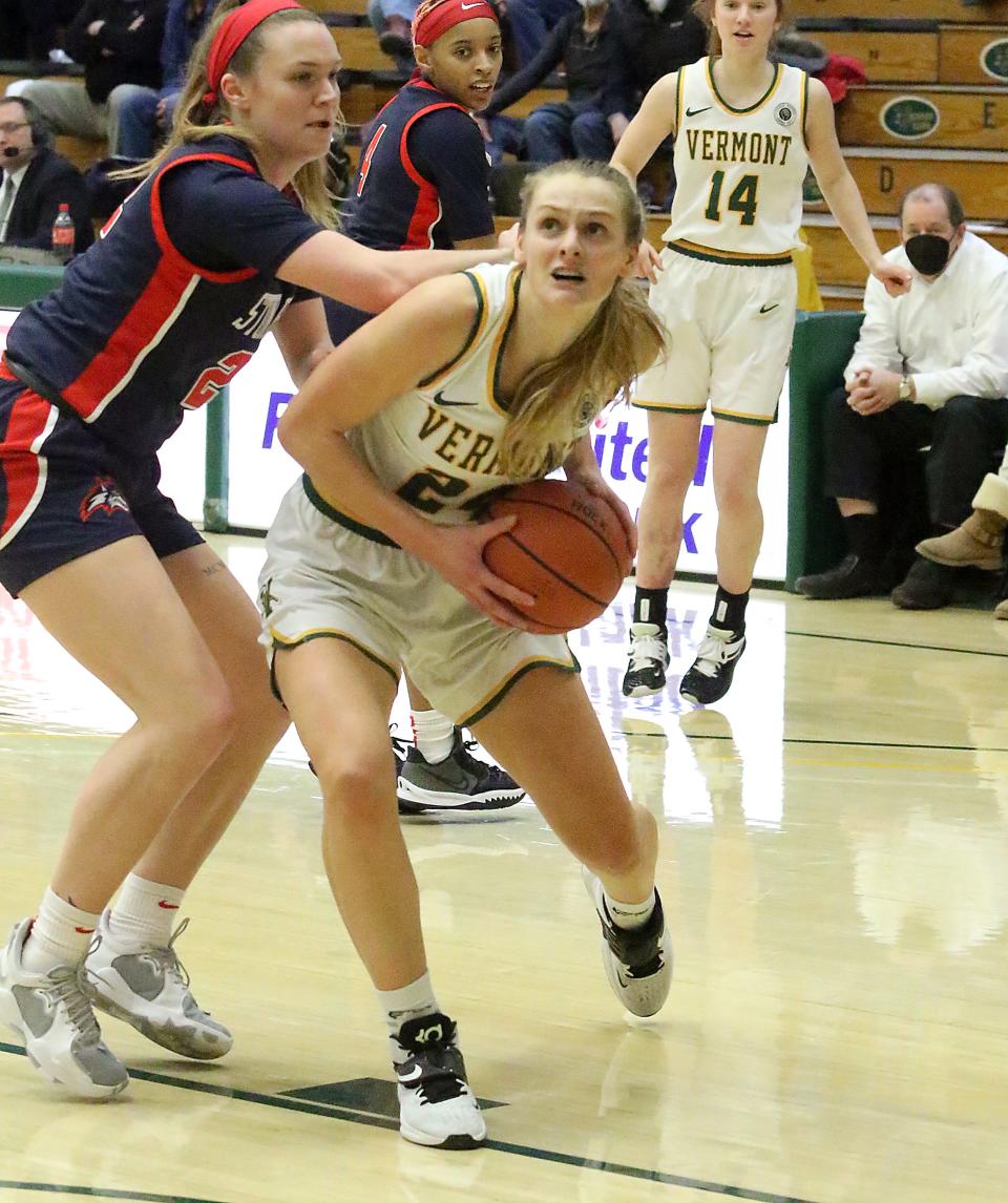 Vermont's Anna Olson takes the ball into the post during the Catamounts 71-63 loss to Stony Brook on Wednesday night at UVM's Patrick Gym.