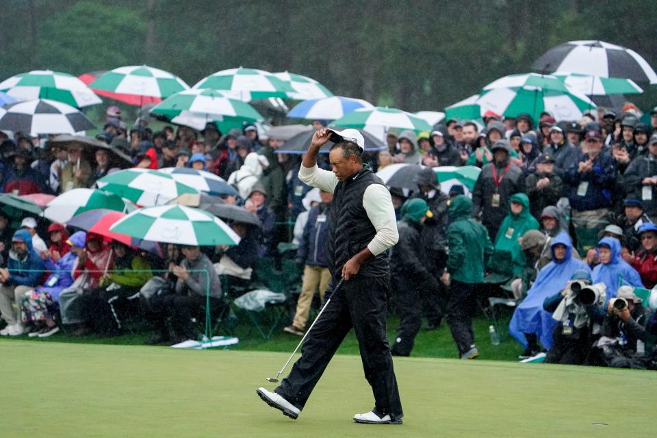 Tiger Woods walks the 18th green on Saturday.